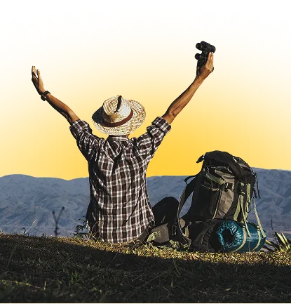 Traveler with backpack enjoying mountain view